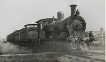 Driver leaning out of the doorway of Y class steam locomotive no. 397, Glen Iris, circa 1922
