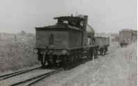 A class steam locomotive no. 122 hauling a goods truck, Darling, circa 1922