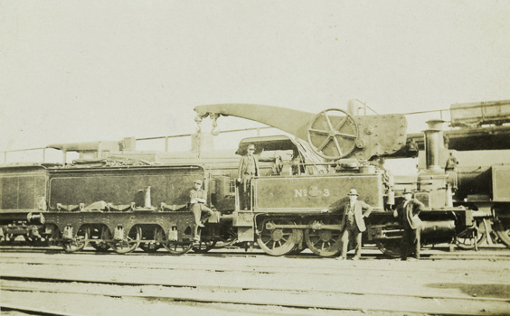 Engine no. 3 with a large crane attached to its side, circa 1910