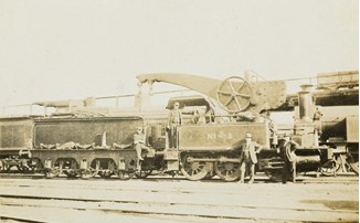Engine no. 3 with a large crane attached to its side, circa 1910