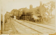 Steam locomotive no. D2 766 with passenger carriages attached, circa 1920