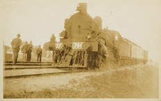 Steam locomotive no. D2 766 with passenger carriages attached, circa 1920