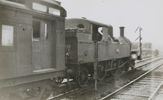 Steam locomotive no. 716 with guard's van attached
