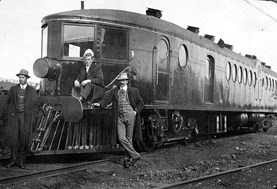 Staff posing with a motor rail, Gippsland, circa 1910