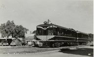 Two carriage diesel train with Victorian Railways logo on its front, Wycheproof, post-1935