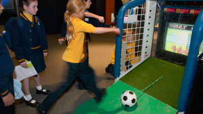 Girl kicking a ball in the Sportsworks exhibition