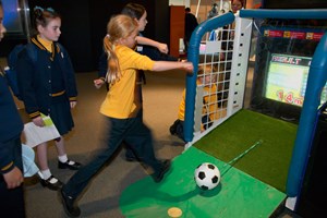 Girl kicking a ball in the Sportsworks exhibition