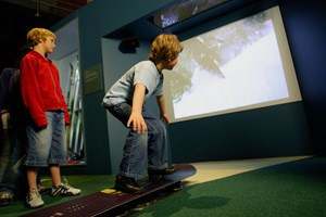 boys using the snowboard interactive