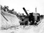 Excavation on track with steam shovel