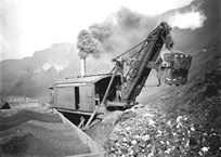 Steam shovel and rail trucks