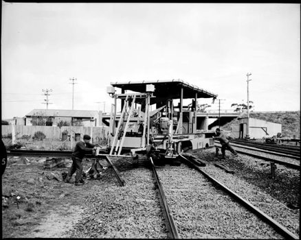 Electromatic track tamper machine being turned