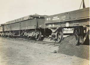 Construction of the Yarrawonga to Oaklands line, Yarrawonga, circa 1930. Ballast has been dropped from a hopper truck in the middle of the track and the ballast plough, attached to the underside of the rear rail trucks, is being spread by a v-shaped mould board.