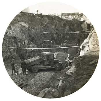 Workers spreading ballast from a tip truck during construction of the South Kensington to West Footscray line, Footscray, 1928