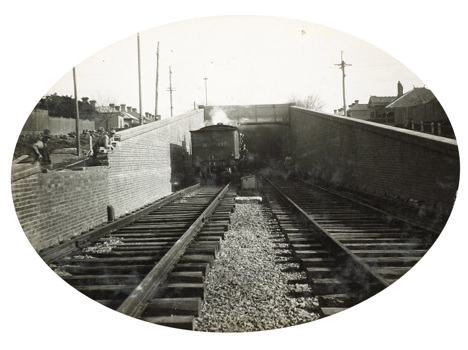 Tunnel construction on the South Kensington to West Footscray line, Footscray, 1928. A ballast train is about to enter the tunnel.