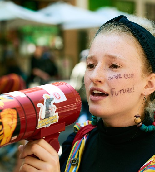 Girl speaking to a megaphone at a School Strike 4 Climate protest, 15 March 2019.