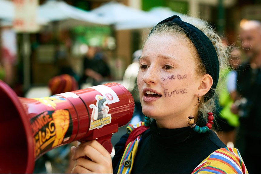 Girl speaking to a megaphone at a School Strike 4 Climate protest, 15 March 2019.
