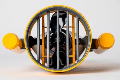 A view of a propellor from the underside. Two yellow handles sit either side of the propellor 