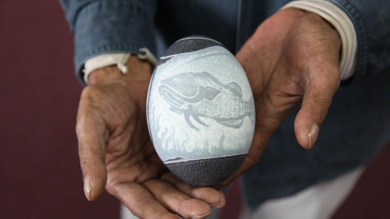 Eric Brown's carved emu egg titled Catching a Feed