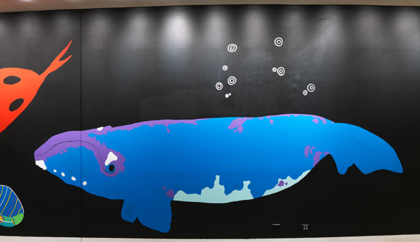 Section from the wall of the Birrarung Gallery featuring a 28 metre mural in honour of Victoria's 44 language groups
