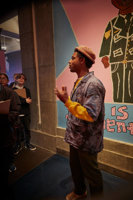 Culture Makers artist Olana Janfa giving a tour of Your Government Name for young people at the Immigration Museum.