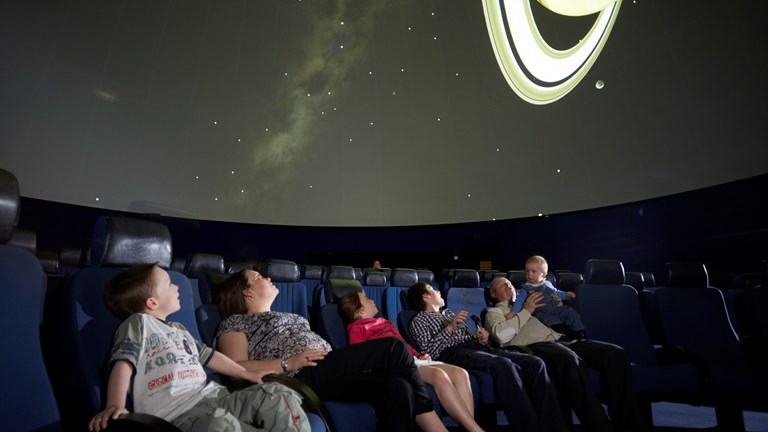 Audience in the Melbourne Planetarium looking up