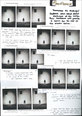 A page from a student design folio that shows a black and white photograph of a girl sitting on the ground in front of a white brick wall with shadows of hands reaching out all about her with hand written annotations about the production  