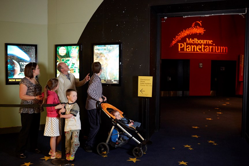 Family lining up for the Melbourne Planetarium 