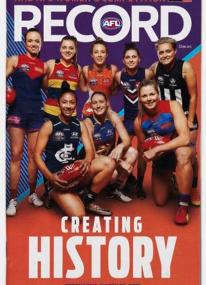 A group of female footy players on the front of a magazine. 