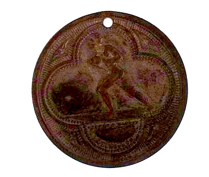 A medallion showing a man running with a football.