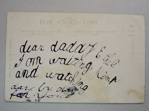 Child's writing on the back of a postcard