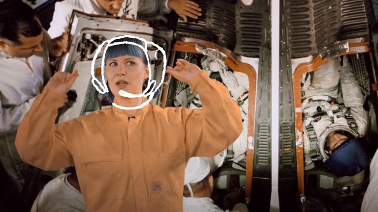 Woman wearing orange overalls superimposed over astronauts in a spaceship