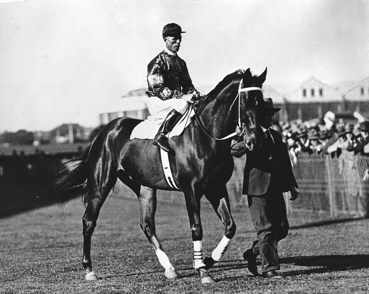 Phar Lap at race track with Jimmy Pike and Tommy Woodcock, 1930.