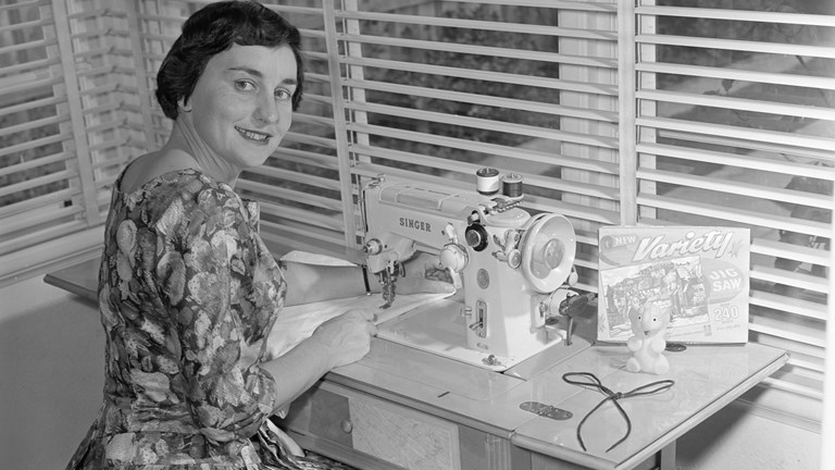 Portrait of Mrs Andrews using a sewing machine at Ashburton.