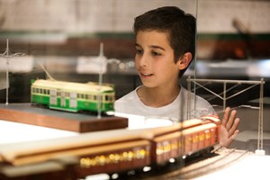 Boy looking at cable tram display