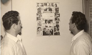 Ugo Ceresoli and his brother Bruno Ceresoli in their rented apartment, looking at family photos and a publicity poster for their appearance on 3UZ radio station, circa 1953