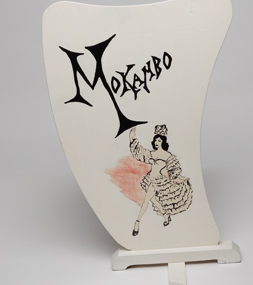 Music stand depicting a female dancer in flamenco garb used by members of the Mokambo Orchestra during the 1950s