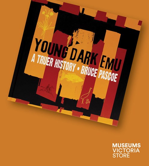 Flat lay image of a book called "Young Dark Emu" on an orange background