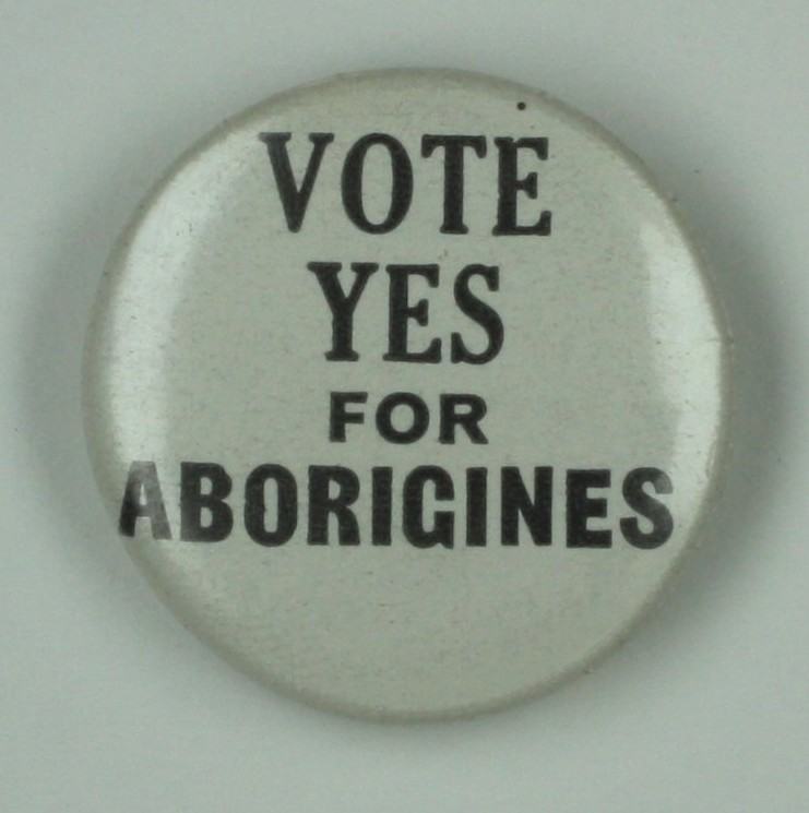White Badge with black text ""Vote Yes for Aboriginies