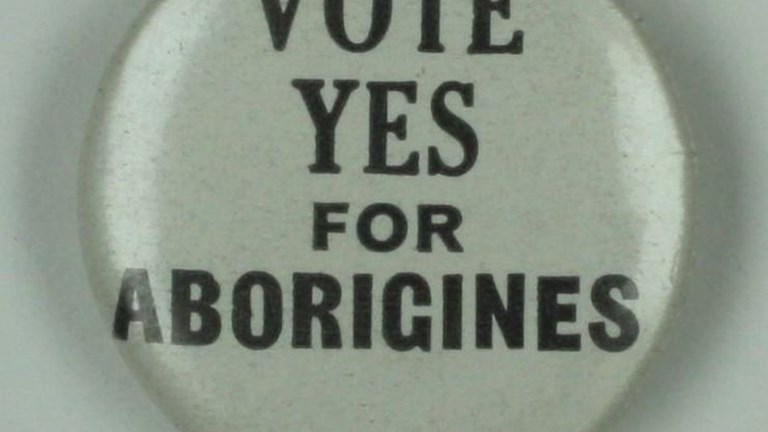 White Badge with black text ""Vote Yes for Aboriginies
