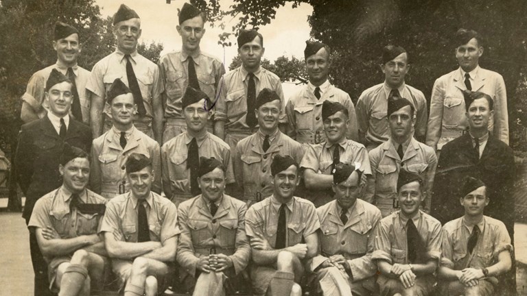 Group photograph of 21 men in uniform
