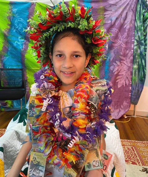 Child with a money lei