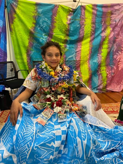 Boy with his  money lei