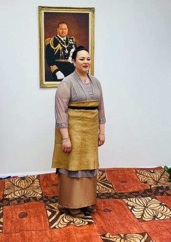 Woman posing in front of a painting