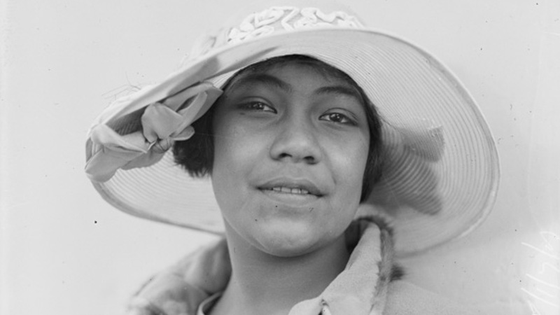 Head shot of a woman wearing a hat