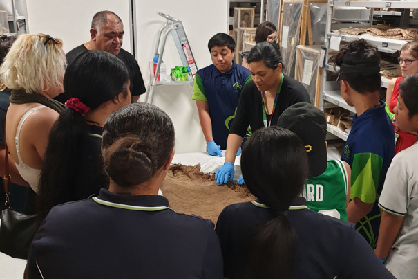 Group of students viewing collection objects