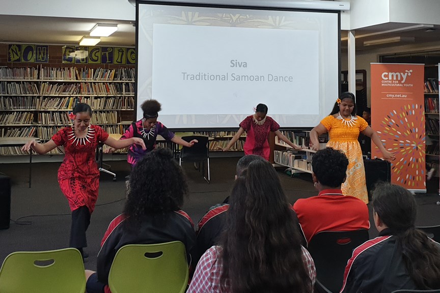 Students dancing in the library