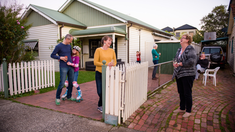 Neighbours interacting across their fence