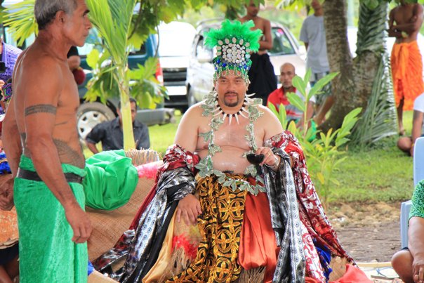 Man sitting on a wearing ceremonial costume