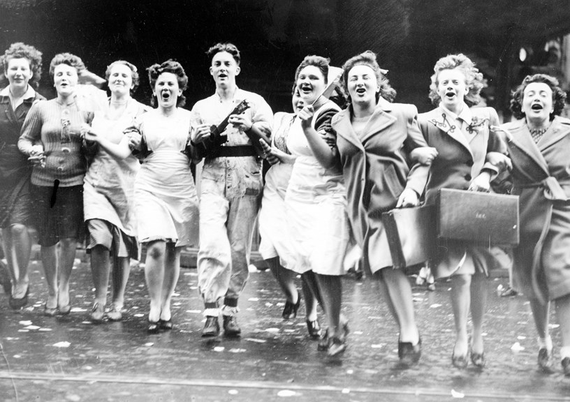 A group of young people celebrating the end of the war