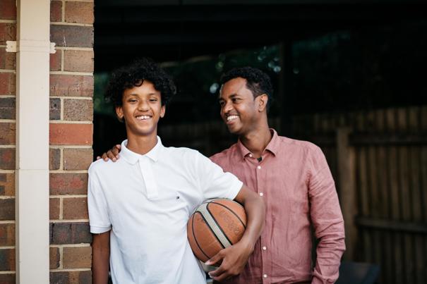 Man and boy smiling